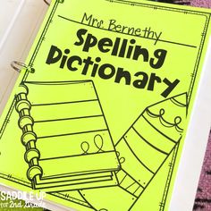 a yellow book with black writing on it that says, mr barnett's spelling dictionary