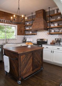 a large kitchen with wooden cabinets and white appliances in the center, along with an island