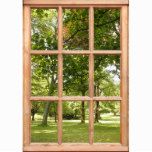 an open window with the view of trees and grass through it's wooden frame