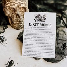 there is a sign that says dirty minds next to some black bugs on the ground