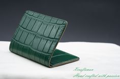 This credit card holder is made of genuine alligator leather and Alran goat leather. The alligator leather is tanned in the highest quality and finished in a very nice green color. It's free from decoloration. The Alran goat leather is well known as one of the best goat leather all over the world. It has a soft touch feeling and deluxe color. DESIGN: This wallet has 1 card slot on the outside for your frequently used card. + 4 card slots on the inside. + 2 hidden slots for folded cash or ID card Green Luxury Card Holder With Interior Slots, Green Leather Luxury Card Holder, Luxury Green Leather Card Holder, Elegant Green Bifold Card Holder, Green Luxury Wallets With Interior Card Slots, Green Luxury Wallet With Interior Card Slots, Luxury Green Wallets With Interior Card Slots, Luxury Green Wallet With Interior Card Slots, Elegant Green Rectangular Card Holder