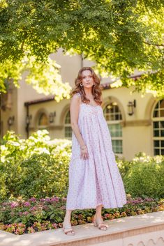 Embrace the warmth of summer with our East Village Pink Pearly Floral Dress by Madeline Marie. This elegant piece features a delicate pink floral pattern on a breezy white fabric, perfect for garden parties and casual outings. The flowy design and adjustable straps ensure comfort and style, making it a must-have for your summer wardrobe. Spring Sundress With Spaghetti Straps For Daywear, Spring Sundress With Adjustable Straps For Daywear, Pink Flowy Sundress With Adjustable Straps, Vacation Sundress With Floral Embroidery And Spaghetti Straps, Spring Floral Embroidered Sundress For Garden Party, Floral Embroidered Sundress For Spring Garden Party, Flowy Spring Sundress For Daywear, Pink Sundress With Adjustable Straps For Day Out, Spring Pink Loose Fit Sundress