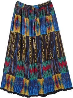 A tribal printed cotton skirt with very visible crinkle and loose elastic waist. The print is nicely crinkled and on stretching reveals a beautiful colorful print. Turquoise, brown, red and green print on a black base. The gypsy effect of the crinkle and the print makes it a unique design. Breathable cotton, not lined is great for comfort and carefree movement. Length: 36" ; Waist: 28"-40" (Elastic with a drawstring); Material: 100% Cotton Bohemian Skirt With Vibrant Print For Vacation, Bohemian Vibrant Print Skirt For Vacation, Bohemian Beach Skirt With Vibrant Print, Bohemian Multicolor Vibrant Print Maxi Skirt, Bohemian Multicolor Skirt With Elastic Waistband, Vacation Skirts, Hippie Skirts, Hippie Look, Scarf Shirt