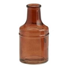 an empty brown glass bottle on a white background