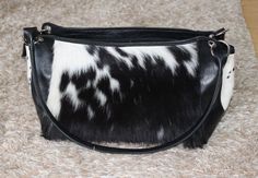 This cowhide shoulder bag is so soft to touch and a real natural, It can make any outfit look complete while protecting your belongings. All our cowhide handbags are free shipping worldwide. You will recieve a cowhide shoulder bag similar to the one shown, we will send you the pattern to choose from and will be custom made to your needs. A perfect blend of cowhide with leather details on these cowhide shoulder purses. Natural cowhide gives this purse an amazing look and look you stunning. Front Black Calf Hair Shoulder Bag For Everyday Use, Black Calf Hair Bag With Leather Handles, Black Calf Hair Bags For Everyday Use, Black Calf Hair Bag For Everyday Use, Everyday Black Calf Hair Bag, Black Calf Hair Rectangular Bag, Western Style Interior, Shoulder Purses, Cowhide Handbags