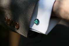 Emerald green fused glass cufflinks in a classic, round design.  The gorgeous dichroic glass used in these handmade cufflinks seems to change colours as the wearer moves, shifting between deep, emerald green to hints of blue and purple. At a Glance: - Colourful fused dichroic glass cufflinks - Free 1st Class UK Delivery - Gift box - Silver Plate or Sterling Silver backs - kiln fused - original designs in every piece. Your pair will be unique - Extra eco-friendly gift wrapping available - Handcrafted in the Fused Glass Studio, Lake District, UK - Colour Change - Emerald Green to Indigo with hints of purple. Each pair of Mere Glass cufflinks features organic, handpainted designs which make each pair unique. The pictures show an example pair - your cufflinks will be similar but not exactly th Green Wedding Jewelry, Groomsmen Cufflinks, Handmade Cufflinks, Deep Emerald Green, Eco Friendly Gift Wrapping, Glass Studio, Jewellery Uk, Wedding Jewellery, Round Design