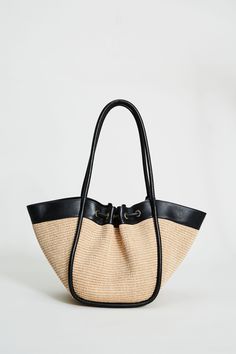 Step into Spring in style with our exclusive Raffia Tote Bag. Handcrafted in Italy, our chic, drawstring handbag is designed in the finest raffia fabric with contrasting Nappa Leather trim & gold handwear. With so many essentials to carry these days, this handbag puts the fashion in function with its knot Closure & ruched detailing. Elie Tahari Exclusive Raffia & Italian Leather Tote Bag with Gold Stud accents & a drawstring Knot Closure Measurements: 10" L, 20" Width, 12" Opening; Base 8"x6" Ma Luxury Straw Bags For Everyday, High-end Straw Bags, Luxury Straw Shoulder Bag For Travel, Luxury Straw Bags For Shopping, Luxury Double Handle Beach Bag For Travel, Vacation Straw Shoulder Bag With Dust Bag, Luxury Beach Bag With Leather Handles For Travel, Luxury Beach Bag With Braided Handles For Travel, Luxury Vacation Shoulder Bag With Rolled Handles