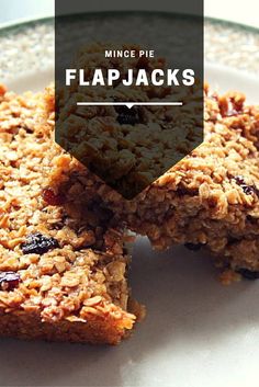 three pieces of granola on a plate with the words, mince pie flapjacks