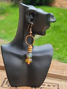 Amber Hoop earrings. Hammered copper earrings. Gemstone earrings. Boho copper earrings. Rustic earrings. Ethnic jewelry. The ear wires are handcrafted from pure copper wire. The copper component is annealed, hammered and polished with Renuesanse wax. ● Material - Copper, Natural stone ● Measures - Total length including the ear wires - about 2.5 inches Artisan Copper Wire Drop Earrings, Artisan Copper Dangle Hoop Earrings, Handmade Copper Round Hoop Earrings, Copper Wire Wrapped Round Hoop Earrings, Unique Bronze Copper Wire Earrings, Artisan Handmade Copper Wire Earrings, Wire Wrapped Copper Hoop Earrings, Artisan Handmade Earrings With Copper Wire, Unique Copper Wire Wrapped Hoop Earrings