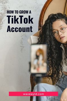 a woman sitting in a chair holding a camera with the words how to grow a tiktok account