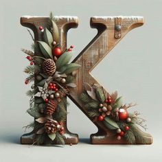 the letter k is decorated with pine cones, berries and evergreen leaves for christmas decorations