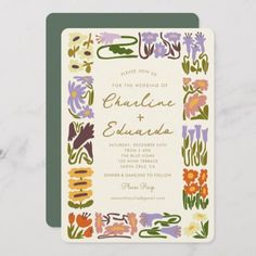 a wedding card with colorful flowers on it