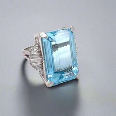 This exquisite Vintage 34.59 Carat Aquamarine and Natural Diamond Platinum Ring makes a bold statement. Crafted with precision, the stunning aquamarine stone shines brilliantly accompanied by sparkling natural diamonds. Perfect for special occasions, this ring exudes luxury and sophistication. Invest in this timeless piece for a touch of elegance. Aquamarine : 34.59 ct. Platinum :  26.8 grams  Diamonds .90 cttw  Clarity VS1-SI1  Color G-H  Ring Size : 6 (ring can be sized) Style : Ring estate piece, all weights are estimates Formal Light Blue Diamond Ring, Formal Light Blue Aquamarine Diamond Ring, Aquamarine Brilliant Cut Diamond Ring For Formal Occasions, Formal Aquamarine Diamond Ring With Brilliant Cut, Luxury Light Blue Rings For Anniversary, Luxury Light Blue Aquamarine Rings, Formal Light Blue Diamond Ring With Center Stone, Elegant Light Blue Aquamarine Diamond Ring, Luxury Light Blue Topaz Ring For Anniversary