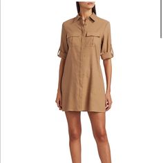 Utilitarian Shirtdress Finished With Classic Roiled Cuff. Spread Collar Short Sleeves Rolled Cuff Concealed Button Placket Linen/Elastane Dry Clean Imported Fitted Button-up Shirt Dress With Cuffed Sleeves, Fitted Button-up Shirt Dress With Roll-up Sleeves, Spread Collar Shirt Dress With Cuffed Sleeves For Work, Shirt Dress With Cuffed Sleeves For Work, Workwear Shirt Dress With Cuffed Sleeves, Casual Shirt Dress With Cuffed Sleeves For Work, Fitted Shirt Dress With Roll-up Sleeves For Fall, Long Sleeve Shirt Dress With Roll-up Sleeves For Office, Fitted Shirt Dress With Rolled Sleeves For Work