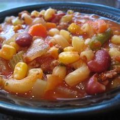 a bowl filled with chili and beans on top of a table