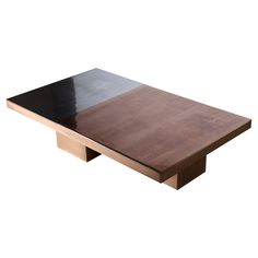 a wooden table with black top and metal base on an isolated white background for display