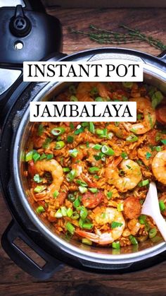 a pot filled with shrimp and rice on top of a wooden table