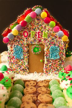 a decorated gingerbread house with lots of sprinkles