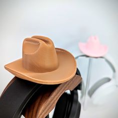 "Add this cute and stylish cowboy hat to your headphones for a country \"Yee-haw\". Howdy on over and attach the hat with a simple piece of hook and loop that you can cut to size for your liking. Great for gaming, live streaming, kids costumes, and more. Lightweight and comfortable while being attached to your headset. A wonderful gift for that special someone for holidays, birthdays, or a treat to yourself. Headphones not included. White hats will come with white hook and loop straps, while all Adjustable Brown Mini Hat As Gift, Adjustable Brown Mini Hats As Gift, Adjustable Brown Mini Hats As Gifts, Headset Attachment, Headphone Attachment, White Hats, Chapeau Cowboy, What A Girl Wants, Yee Haw