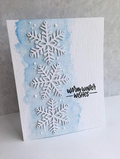 a card with snowflakes on it that says warm winter wishes