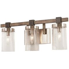 three light bathroom fixture with clear glass shades and wood frame, on an isolated white background