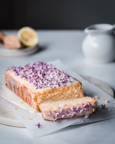 a piece of cake with purple sprinkles on it