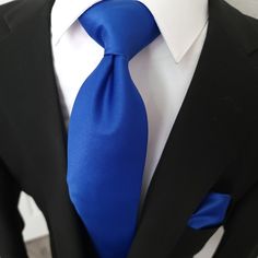 Treat yourself with a new pattern and splash of color to your look with this unique tie set. 100% Silk Handmade Package Includes: Tie, Pocket Square & Cufflinks. Length: 59" Width: 3.34" Warm iron if needed Blue Formal Suit And Tie Accessories, Blue Standard Tie For Formal Suit, Elegant Blue Suit And Tie Accessories For Father's Day, Blue Tie For Black Tie Event And Father's Day, Classic Royal Blue Suit And Tie Accessories For Business, Elegant Blue Tie For Father's Day, Classic Adjustable Blue Suit And Tie Accessories, Blue Elegant Tie For Father's Day, Formal Blue Adjustable Suit And Tie Accessories