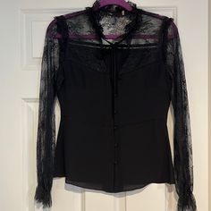 New Without Tags. Never Been Worn. Excellent Condition. No Rips Or Stains. Runs Small. Size Xs. Silk With Lace. Black Office Top With Sheer Sleeves, Elegant Lace Trim Office Tops, Fitted Lace Top Blouse For Work, Elegant Lace Trim Tops For Office, Fitted Long Sleeve Lace Top For Work, Fitted Lace Top Blouse For Office, Formal Black Fitted Blouse, Fitted Lace Trim Top For Work, Chic Fitted Lace Top Blouse