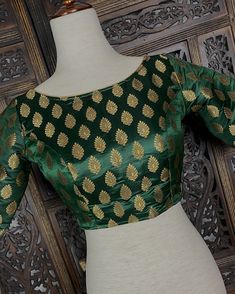 Boat Neck Pure Banarasi Bottle Green Color Blouse with Gold Buttis. Comes with Cups attached to the blouse. Item : Blouse Size : 36 (Can be opened to Size 42) Size : 40 (Can be opened to Size 44) Color : Bottle Green Blouse Fabric : Pure Banarasi Blouse Fitting : Princess Cut Lining : Yes, it is fully lined Padded or Non-Padded : Padded Closure: Back Closure with hooks. Ready-to-Wear : Yes Please note : This is a Standard Size blouse. We do not guarantee perfect fit as every body and shape is di Blouse Fitting, Bottle Green Blouse, Banarasi Blouse, Color Blouse, Readymade Blouse, Bottle Green, Green Blouse, Blouse Fabric, Princess Cut