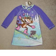 Girls Pj's & Keychain Condition- New With Tags $28 Made By- Bobby Jack Color- Purple Size- 4/6 Sweet Style. This Girls' Bobby Jack Monkey Nightgown And Keychain Set Will Be Her Favorite. In Purple. Bobby Jack And Mouse Snowboarding And Winter Graphics Provide A Holiday Touch. Matching Keychain Adds Fun Flair. Supersoft Construction Keeps Her Comfy. 2-Piece Set Set Includes: Short-Sleeved Nightgown & Key Chain 100% Polyester Machine Wash Garments Are Flame Resistant Playful Long Sleeve Winter Sleepwear, Multicolor Cartoon Print Sleepwear With Long Sleeves, Multicolor Winter Sleepwear For Sleepover, Winter Long Sleeve Nightgown For Sleepover, Cute Purple Long Sleeve Sleepwear, Bobby Jack Monkey, Disney Princess Gowns, Men's Nightgown, Winter Graphics