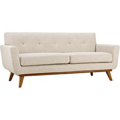 a white couch sitting on top of a wooden frame