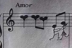 an image of music notes and musical staffs on a sheet with the word'amor '