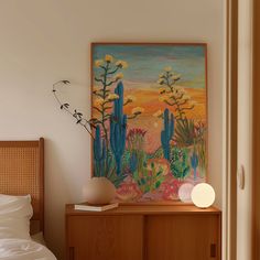 a painting is hanging on the wall above a bed with white sheets and pillows next to a wooden cabinet