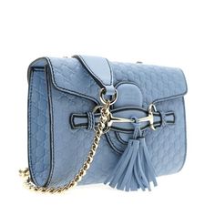 The Gucci Emily Shoulder Bag In Mineral Blue Is Crafted From Calfskin Leather In Italy. This Small, Periwinkle Bag Can Be Worn As A Shoulder Or Crossbody, And Features An Embossed Interlocking Gg Microguccissima Print, Top Flap With Horse-Bit Decorated Closure, Tassel Accents, And A Chain Strap. Gucci Emily Shoulder Bag In Mineral Blue Silver-Tone Hardware Crossbody Or Shoulder Bag Top Flap With Slide Closure Embossed Microguccissima Print Horse-Bit Detail Dual Tassel Accents Chain Strap Strap D Blue Gucci Shoulder Bag With Branded Hardware, Formal Blue Gucci Bag, Luxury Blue Gucci Bags, Formal Blue Gucci Shoulder Bag, Blue Gucci Bag For Formal Occasions, Blue Gucci Crossbody Shoulder Bag, Blue Gucci Shoulder Bag For Formal Occasions, Gucci Blue Shoulder Bag With Detachable Strap, Blue Gucci Shoulder Bag With Detachable Strap