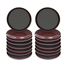 a stack of brown and black plates on top of each other