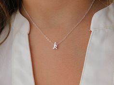 "Our dainty letter necklace is a perfect gift for a friend, new mom or a treat for yourself. Wear it alone or order two necklaces to get that perfect trendy layered look! N E C K L A C E - D E T A I L S: Cursive Letter: Rhodium Plate or Gold Plate over Brass Dainty but Sturdy 14k Gold Fill or Sterling Silver Chain & Components Model is wearing a 16 inch. Available in: 15\" choker 16\" shown in model 17\" Packaging: Your necklace will arrive packaged in a jewelry gift box tied with a ribbon, Dainty Silver Initial Necklace For Birthday, Silver Charm Necklaces With Delicate Chain For Birthday, Simple Nickel-free Charm Necklace As Gift, Simple Nickel-free Charm Necklaces As Gifts, Simple Nickel-free Charm Necklaces For Gifts, Simple Hypoallergenic Charm Necklaces As Gift, Simple Hypoallergenic Charm Necklaces For Gifts, Tiny Initial Pendant Charm Necklace For Gifts, Simple Initial Pendant Charm Necklace For Gift