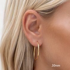 A classic earrings set featuring a trio of gold hoop earrings in various sizes.

Hoop diameters measure at 12mm, 20mm and 30mm. Classic Earrings, Hoop Earring Sets, Gold Hoop, Silver Hoops, Gold Hoop Earrings, Silver Hoop Earrings, Earrings Set, Earring Set, Hoop Earrings