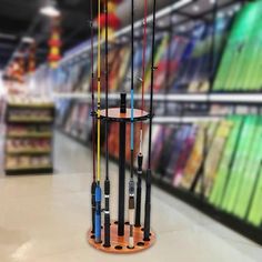 a rack with fishing rods on it in a store