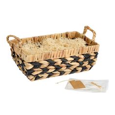 a woven basket with two handles is shown next to a packet of rice and some other items