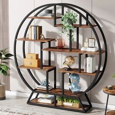 a book shelf with books and plants on it in front of a wall mounted circular shelving unit