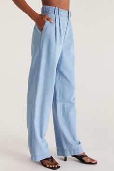 COLOR: Chambray﻿ Vintage high-rise styles are trending, and we know you'll love the full-length, wide-leg of the Farah Trouser. Made from our breezy, cool Rayon Linen fabric, it features a pleated flat front zipper fly with elastic at the back waist and front pockets for comfort and function. This trouser has a fitted high waist but is relaxed through the hip and thigh, so size down if you're looking for a less relaxed look. ﻿SWIRL STYLIST NOTE* Try pairing the Farah Trouser with our Sirena Tan Chambray Pants, Sticky Bra, High Rise Style, Twill Fabric, Hook Eye, Cotton Pants, Ladies Boutique, Long Pants, S Models