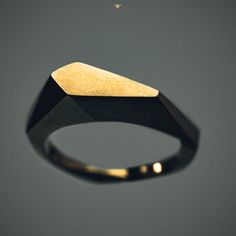 Ursa Minor - Low Polygonal Ring by h i p p i e k o a l a Straight geometric shapes with the highest level of organic comfort . Designed in outer space. Ring size - 16,00 mm (0.630 inches) inside diameter Metal - bronzeIf you need another size, please contact us.If you don't know your size follow this link: http://www.ringsizes.co/PROCESSING TIME - takes 1-2 business days + delivery 7-14 business days to Europe, and 7-31 business days to United States and CanadaThank you for visiting our shop.You Modern Brass Signet Ring, Modern Metal Rings With Unique Design, Modern Faceted Ring Jewelry, Modern Jewelry Ring With Unique Design, Modern Ring With Unique Design, Modern Geometric Jewelry With Unique Design, Unique Black Geometric Jewelry, Unique Geometric Rings For Gifts, Contemporary Rings With Unique Design For Gift