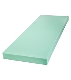 a light green foam mattress on a white background