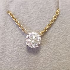 Keep your 2 carats Round diamond close to your heart with this mesmerizing 14K / 18K Yellow gold pendant & necklace. With a 2 carats as its main diamond, this design is guaranteed to draw attention in every scenery. Jewelry Details Main Diamond Accent Diamonds Total Carat Weight: 2 cts Gold KT: 14K / 18K Gold Color: Yellow Size: Resizable Certificate: GIL Shape: Round Weight: 2 cts Color: F Clarity: SI1 Natural Earth-Mined Diamond Shape: Weight: 0 cts Color: E-F Clarity: VS-SI Natural Earth- Exquisite Round Diamond Pendant Necklace, Fine Jewelry Diamond Pendant With Prong Setting, Exquisite Diamond Round Pendant Necklace, Lab Grown Diamond Pendant Necklace, Exquisite Round Pendant Diamond Necklace, Exquisite Diamond Necklace With Round Pendant, Yellow Gold Moissanite Round Cut Necklace, Brilliant Cut Pendant Diamond Necklace, Exquisite Diamond White Pendant Necklace