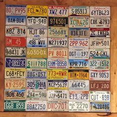 a large number of license plates are on display