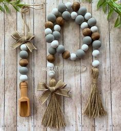 the beads and tassels are on display next to each other, along with a wooden spoon