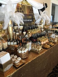 a table filled with lots of different types of desserts