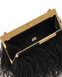 Dolce & Gabbana Medium Marlene Fringe Shoulder Bag in Black Vintage brass turn-lock fastening Chain shoulder strap Embellished ostrich feathers Satin lining Interior flat wall pocket 9” W x 5.5” H x 1.7” D Made in Italy Luxury Formal Bags With Feathers, Luxury Formal Feathered Bags, Luxury Evening Bag With Feather Trim, Luxury Evening Bags With Feather Trim, Elegant Bags With Feather Trim For Events, Elegant Evening Bags With Feathers, Chic Formal Bags With Feathers, Formal Chic Bags With Feathers, Chic Formal Feather Bags