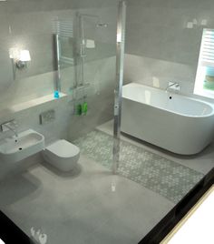 a bathroom with a tub, toilet and sink is shown in this image from the inside