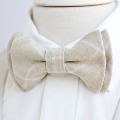 "Dapper Men's Natural Linen Windowpane Bow Tie Made By The Belle And The Beau! ♥ Beautiful linen/cotton blend yarn dyed woven fabric! Our dapper, modern, stylish, and charming neckties are perfect for everyday, Sunday best, all special occasions, photography sessions, and especially dapper on grooms and groomsmen! They are the perfect wedding accessory. We use the best cotton and cotton blend fabrics. We love that cotton is so versatile to dress up or down for any occasion. Each bow tie has a do Dapper White Adjustable Bow Tie, Dapper Adjustable White Bow Tie, Classic White Ties For Groom, Classic White Tie For Groom, Classic Summer Tie For Groom, White Ties For Black Tie Events On Father's Day, White Tie For Black Tie Events, Fitted Bow Tie For Father's Day, Dapper White Suit And Tie Accessories For Summer